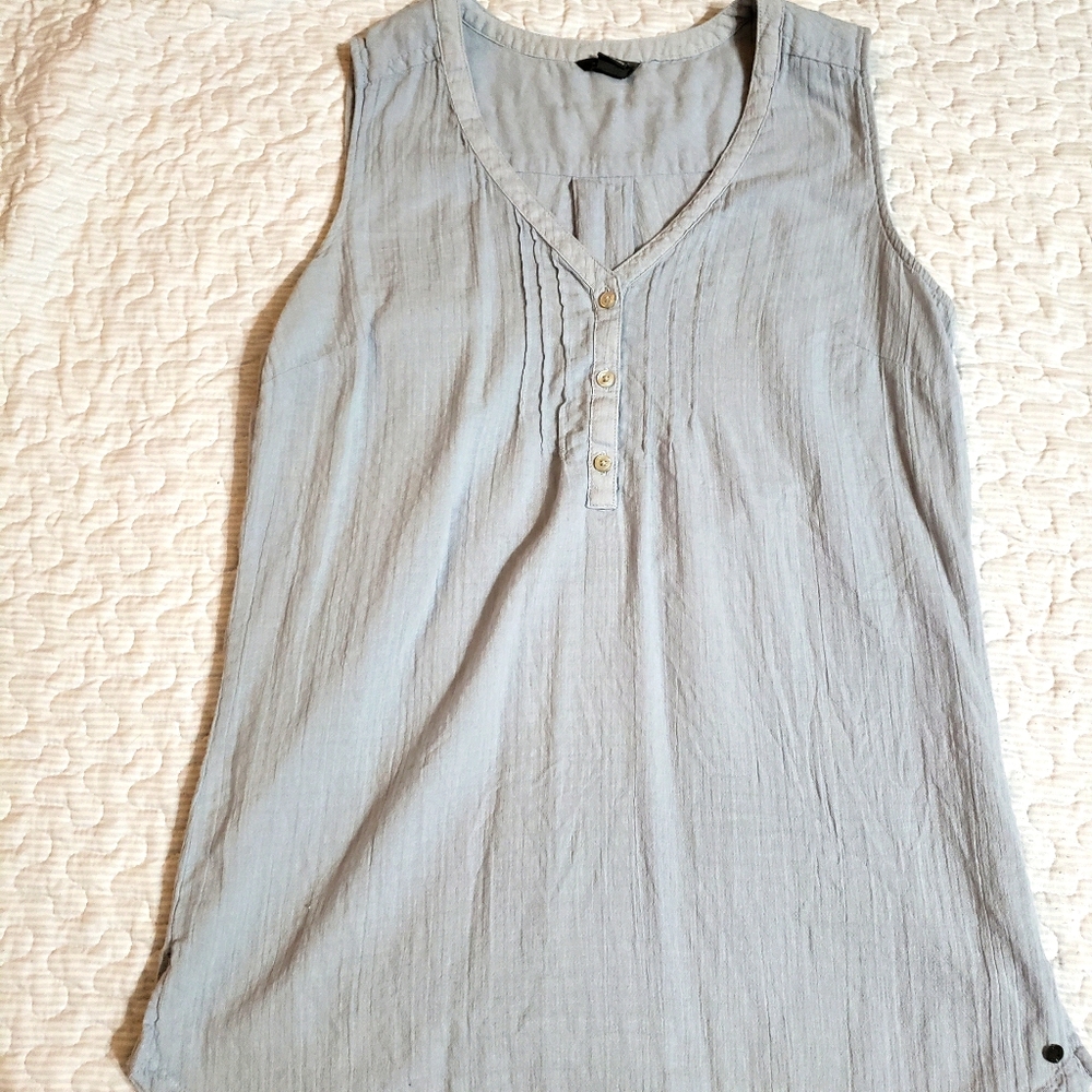 Light blue sleeveless blouse w/ button detail